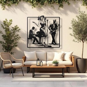 May include: Black metal wall art depicting a jazz band with a singer, pianist, and saxophonist. The artwork is framed and mounted on a beige wall, with outdoor furniture in the foreground, including a wicker chair, sofa, and coffee table.