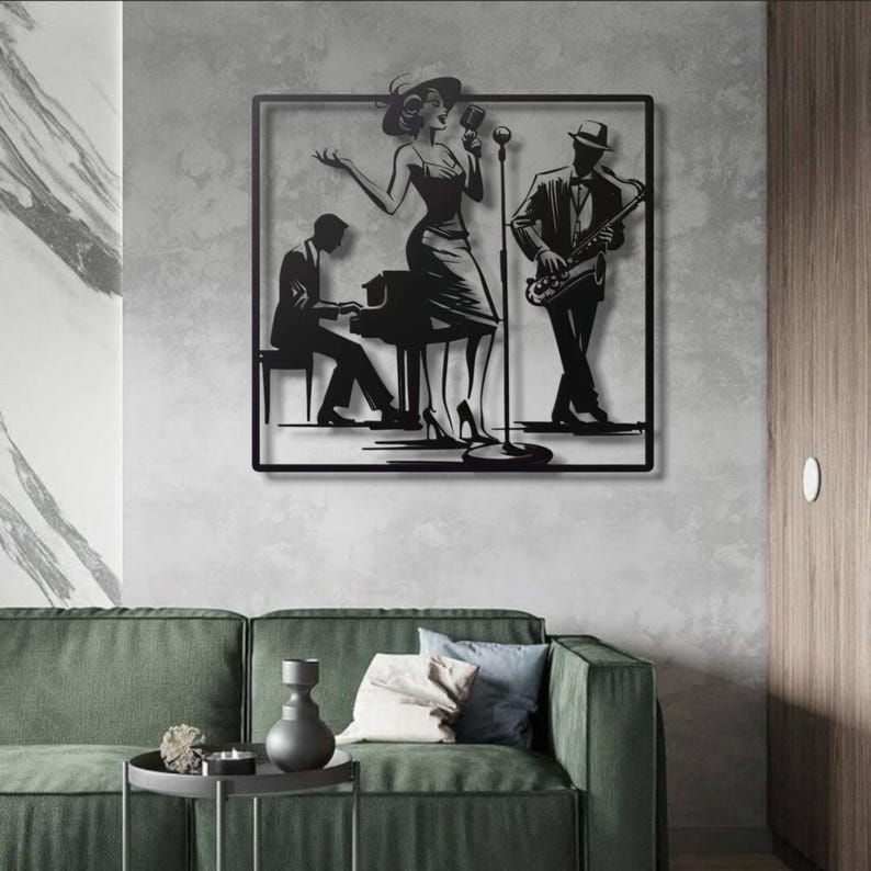 May include: Black metal wall art depicting a jazz band. A woman in a dress sings into a microphone, a man plays the saxophone, and another plays the piano. The art is framed in a black square and mounted on a gray wall.
