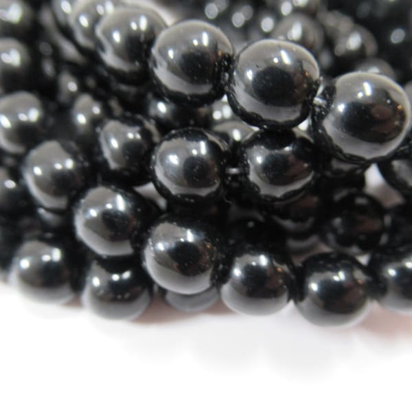 Black 6mm Czech Glass Round Druk Jewelry Beads with a Shiny Finish on strand of 25 beads