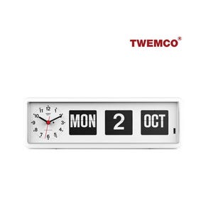 May include: White flip clock with a round analog clock face on the left and a digital display for the day and date on the right. The clock shows "MON 2 OCT". The brand name "TWEMCO" is displayed in red.