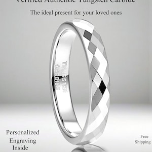 May include: A silver tungsten carbide ring with a geometric faceted design. The ring has the words "Tungsten Carbide" engraved on the inside. The image also includes the text "Personalized Engraving Inside".