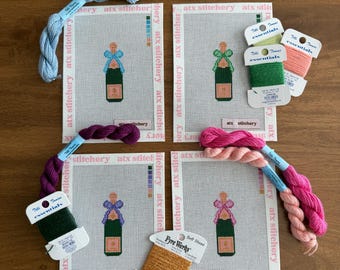 Lienzo bordado con una botella de champán y un lazo de colores: decoración para carritos de bar