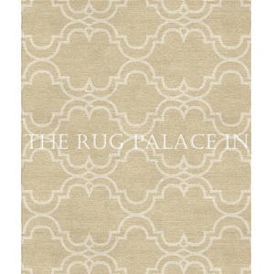 May include: Beige area rug with a repeating quatrefoil pattern in off-white. The rug has a textured appearance and the text "THE RUG PALACE IN" is visible.