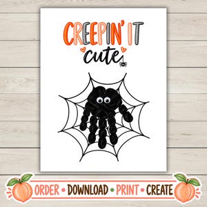 May include: A white rectangular print featuring the orange and black text CREEPIN' IT CUTE with two small orange hearts and a spider icon. Below the text is a black handprint spider with googly eyes centered on a black spider web illustration.