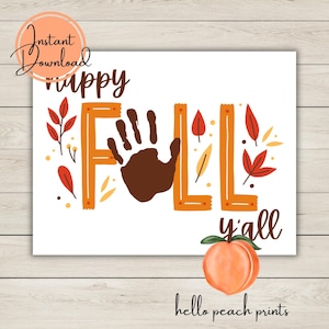 May include: A white rectangular print with the words "Happy Fall y'all" in brown and orange. The letter "L" is formed by a brown handprint. The print includes fall leaves and a peach illustration. The words "Instant Download" and "hello peach prints" are also present.
