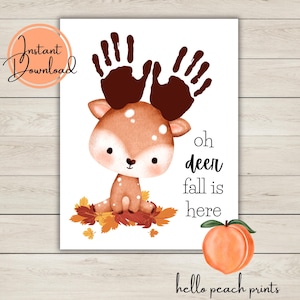 May include: A whimsical print featuring a cartoon deer with handprint antlers, sitting on autumn leaves. The text "oh deer fall is here" is displayed, along with a peach illustration and the words "Instant Download" and "hello peach prints".