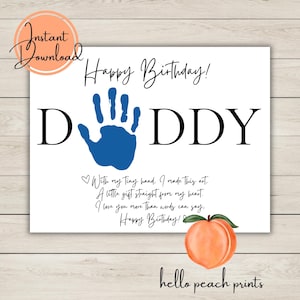 May include: A white card with the words "Happy Birthday!" and "DADDY" in black. A blue handprint is in the center. The card also includes a peach illustration and the text "With my tiny hand..." and "hello peach prints."