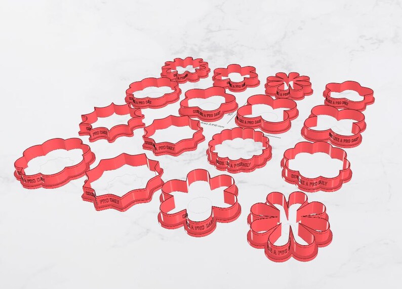 May include: A collection of red plastic cookie cutters in various floral and decorative shapes. The cutters are arranged on a white surface, with some text visible on the sides. The shapes include flowers, scalloped ovals, and other stylized designs.
