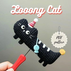 May include: A black crochet cat with white accents, wearing a party hat. The cat has a blue fish pendant and a yellow pom-pom tail. The text "Looonng Cat" is above the cat, and a tag says "PDF pattern".