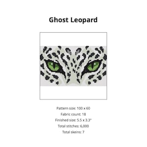 May include: A cross-stitch pattern titled Ghost Leopard featuring a pixelated leopard face with piercing green eyes and black spots on a white background. The text indicates a pattern size of 100 by 60, 18 fabric count, and 5.5 by 3.3 inch finished size.