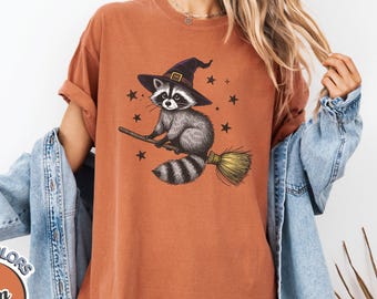 Comfort Colors Raccoon Witch Shirt, Funny Trash Panda Halloween Tee, Spooky Broomstick Graphic T-Shirt, Cute Fall Animal Top