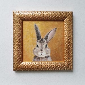 Miniature rabbit portrait wall art with detailed brushwork.