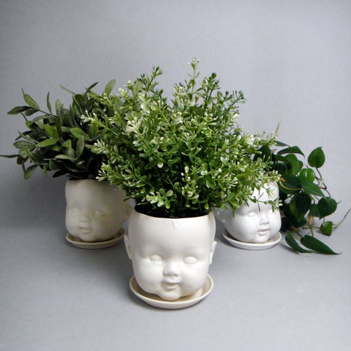 Porcelain Baby doll head planter /or candy dish - hairline crack