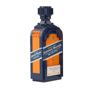 May include: A navy blue and orange block construction of a Johnnie Walker Black Label bottle. The bottle features the Johnnie Walker logo and text, with "Year of the Pig" and "2019" printed on the label. The bottle is a limited edition design.
