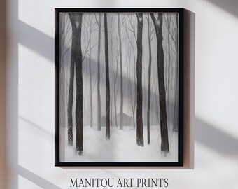 May include: Black framed art print depicting a winter forest scene. Tall, dark tree trunks stand in a snowy landscape, with a soft, gray background. The text "MANITOU ART PRINTS" is printed at the bottom of the frame.