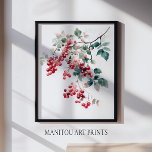 May include: A framed watercolor print featuring a branch with red berries and green leaves. The artwork is set against a white background and framed in black. The text "MANITOU ART PRINTS" is at the bottom.