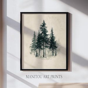 Può includere: Stampa artistica incorniciata con un'illustrazione ad acquerello di alberi sempreverdi in tonalità verdi e grigie. L'opera d'arte è ambientata su uno sfondo beige e incorniciata in un bordo nero. Il testo "MANITOU ART PRINTS" è in basso.