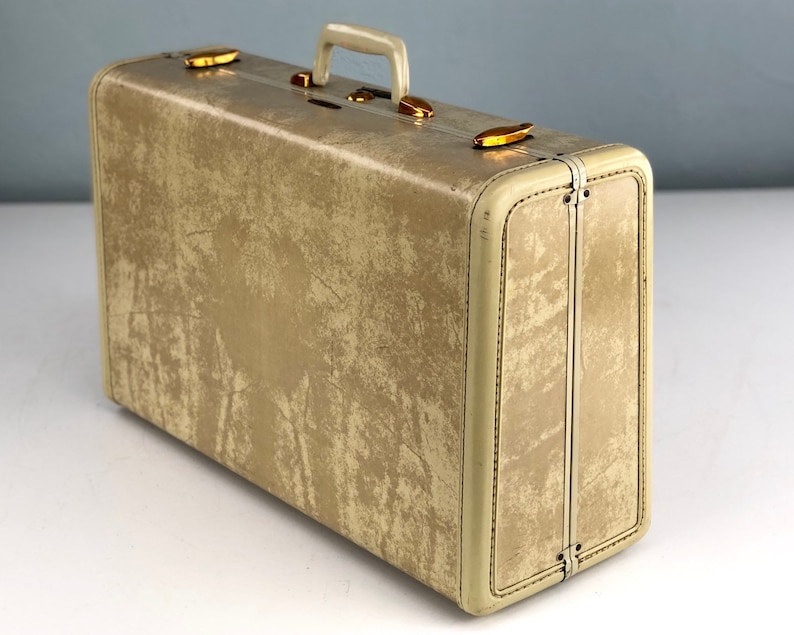 white vintage luggage