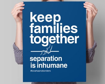 May include: A person holding a blue poster with white text that reads "keep families together - separation is inhumane #lovehasnoborders".