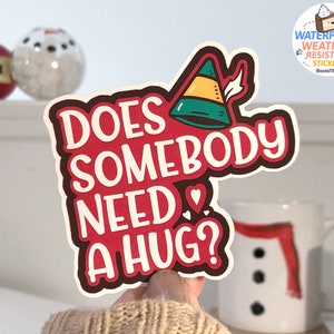 ¿Alguien necesita una pegatina de abrazo, pegatina de cita de elfo, pegatina de Navidad divertida, calcomanía de vinilo IMPERMEABLE, lindas calcomanías de vacaciones, decoración navideña divertida