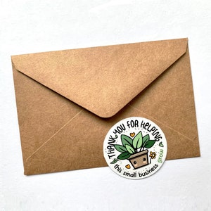 May include: A white round sticker with a green plant in a brown pot. The sticker says "Thank you for helping this small business grow".
