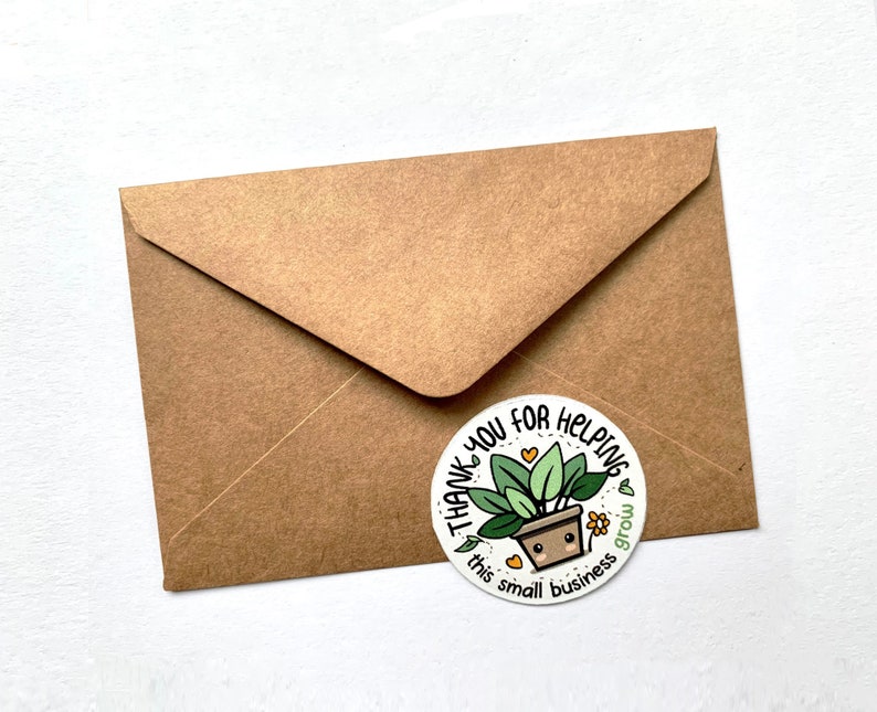May include: A white round sticker with a green plant in a brown pot. The sticker says "Thank you for helping this small business grow".