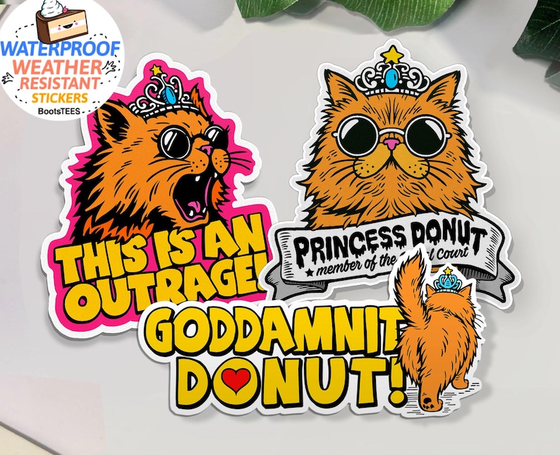 May include: A set of orange cat stickers with crowns and sunglasses. One sticker reads "THIS IS AN OUTRAGE!" in yellow text on a pink background. Another says "PRINCESS DONUT member of the court". The third sticker says "GODDAMNIT DONUT!" with a heart.