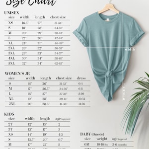 May include: Size chart for unisex, women's, kids, and baby clothing. The chart includes measurements for width, length, chest size, dress size, and age. The chart is displayed on a white background with a light blue t-shirt in the upper right corner.