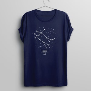 May include: Navy blue t-shirt with a white graphic of the Gemini constellation and the text "GEMINI II".