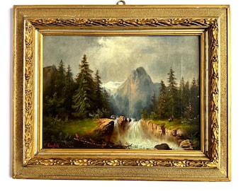 May include: An antique landscape oil painting in a gold ornate frame. The artwork depicts a mountain scene with a waterfall, trees, and a cloudy sky. The frame has a decorative border.