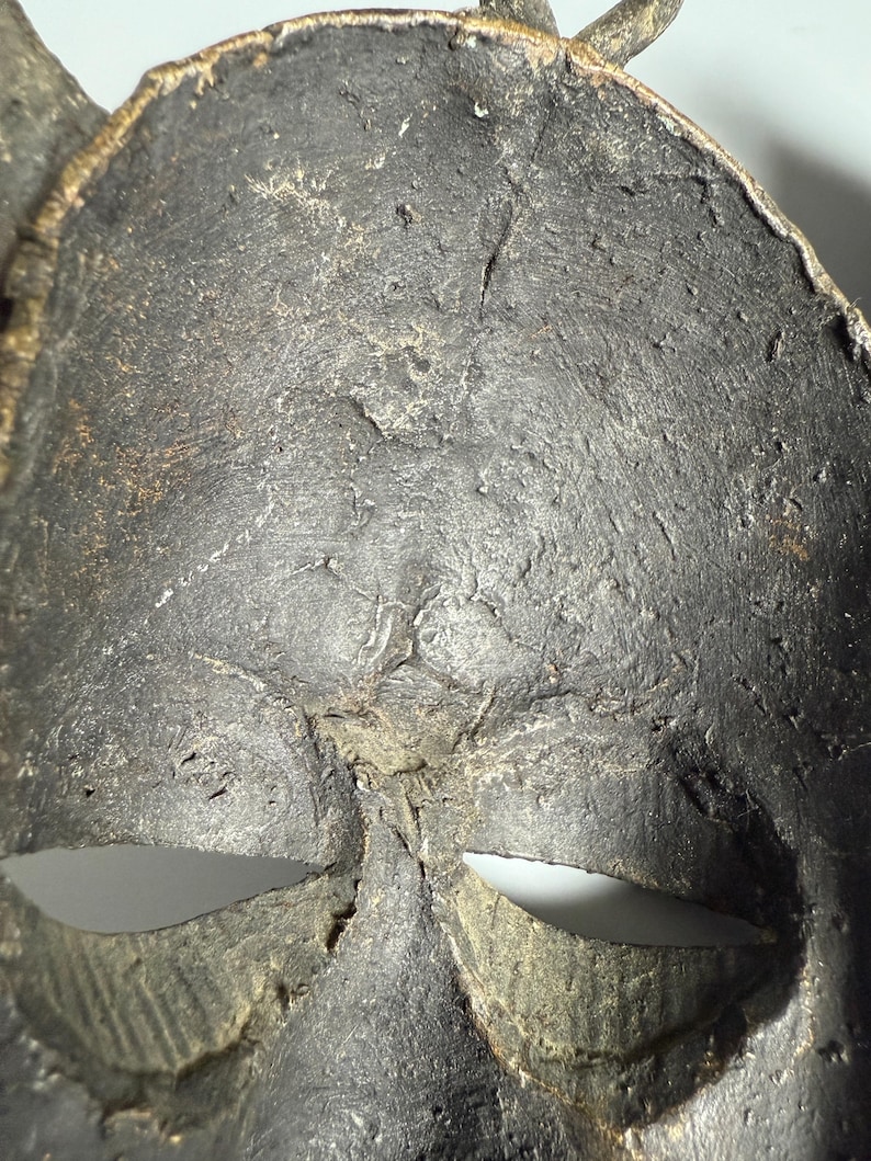 Inside texture African bronze mask authentic patina collectible art