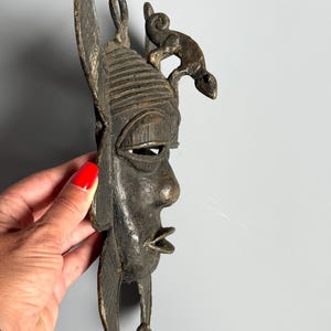 Side profile African bronze mask with lizard figure handmade lost-wax