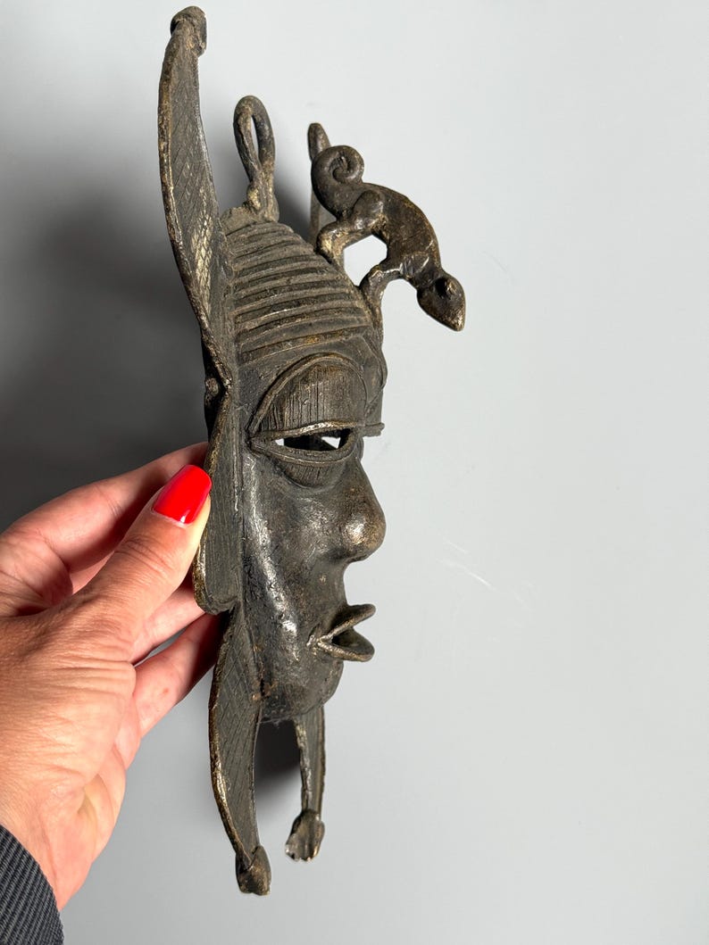 Side profile African bronze mask with lizard figure handmade lost-wax