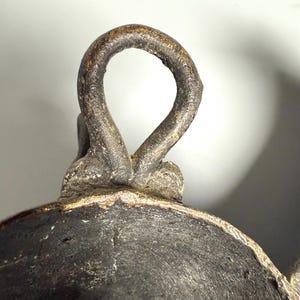 Hanging loop detail African bronze mask tribal vintage decor