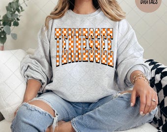 May include: A light gray sweatshirt with the word "TENNESSEE" in large, orange and white checkered letters. The text "DAIZY LANE DIGITALS" is in the upper right corner. The words "DIGITAL DOWNLOAD - PNG" are at the bottom.