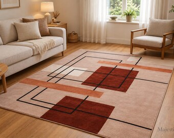 Può includere: Un tappeto rettangolare con base beige chiaro e un motivo geometrico composto da quadrati rosso scuro, sottili linee nere e fasce orizzontali arancioni. Il design presenta forme sovrapposte e accenti lineari sulla superficie.