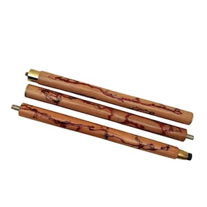 May include: Three wooden walking cane shafts with red veining and brass accents. The shafts are made of light brown wood with a natural grain pattern. The ends have metal fittings for assembly. The canes are designed for support and mobility.