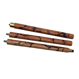 May include: Three wooden walking cane shafts with a dark brown, lightning-like pattern. The shafts are a light brown color and have brass or gold-colored tips. The ends have metal screw threads.