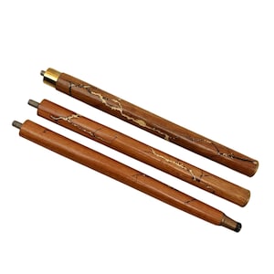 May include: Three wooden walking cane replacement tips. The tips are brown with gold-colored accents. The top tip has a gold-colored metal cap. The tips are angled and have metal screw ends.