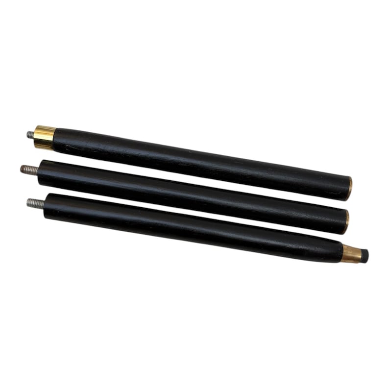 May include: Three black wooden furniture legs with brass-colored metal accents. The legs have threaded ends for easy attachment. The legs are cylindrical and appear to be new.