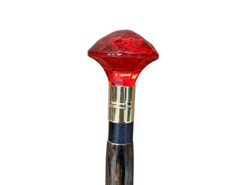 Walking stick with red crystal handle, carved dark wood, elegant cane
