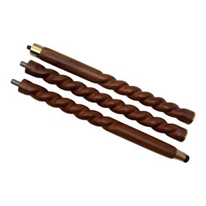 May include: Three wooden walking cane shafts with a spiral design. The shafts are a dark brown color with brass-colored metal accents on the ends. The shafts have a threaded end for attachment.