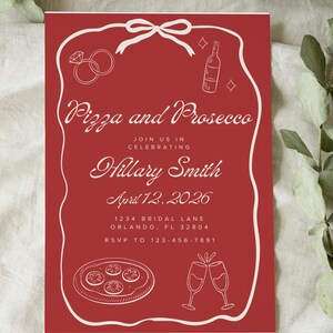 May include: Red invitation with white line art. The text reads "Pizza and Prosecco" and "Join us in celebrating Hillary Smith April 12, 2026". Includes illustrations of rings, a bottle, pizza, and champagne glasses.