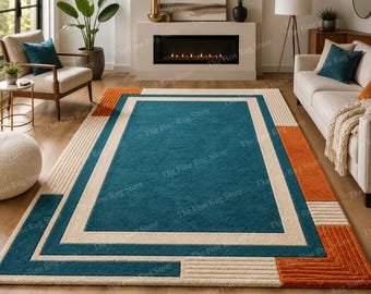 Alfombra moderna tejida a mano con estampado geométrico – Alfombra abstracta de lana de lujo en tonos verde azulado, azul y marfil, ideal para la decoración de salas de estar o dormitorios contemporáneos.