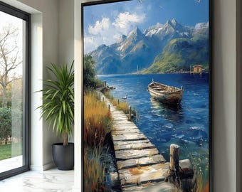 May include: A framed landscape painting depicts a serene lake scene with a wooden dock extending into the water. A small boat floats nearby, with mountains in the background. The artwork features a blue sky with clouds and a cabin on the shore.