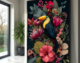 May include: A framed art print featuring a toucan bird with a yellow beak and blue feathers, surrounded by vibrant pink and red flowers and lush green foliage. The artwork is set against a dark background.