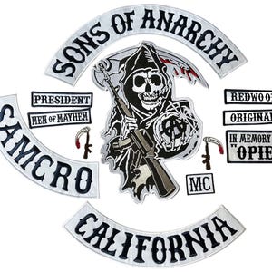 May include: A collection of embroidered patches with the words "SONS OF ANARCHY", "SAMCRO", and "CALIFORNIA". The central patch features a grim reaper with a rifle. Additional patches read "PRESIDENT", "MEN OF MAYHEM", "REDWOOD", "ORIGINAL", and "IN MEMORY OF OPIE".
