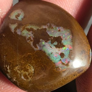A stunning Australian boulder matrix opal featuring a natural ironstone host with vivid pockets of multi-colored fire. solid 5.2g 26ct