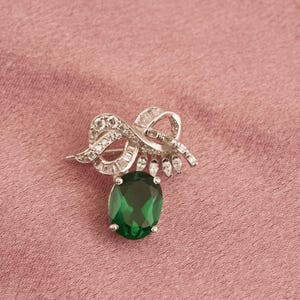 Emerald & Diamond Brooch: 14k White Gold Plated Sterling Silver Ribbon Pin