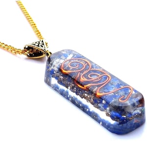 May include: A rectangular pendant necklace with a gold chain. The pendant is a clear resin with blue and silver flecks, and a copper wire design. The pendant is approximately 3.8 cm long.